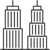 Modern commercial office building with glass facade, city skyline background.